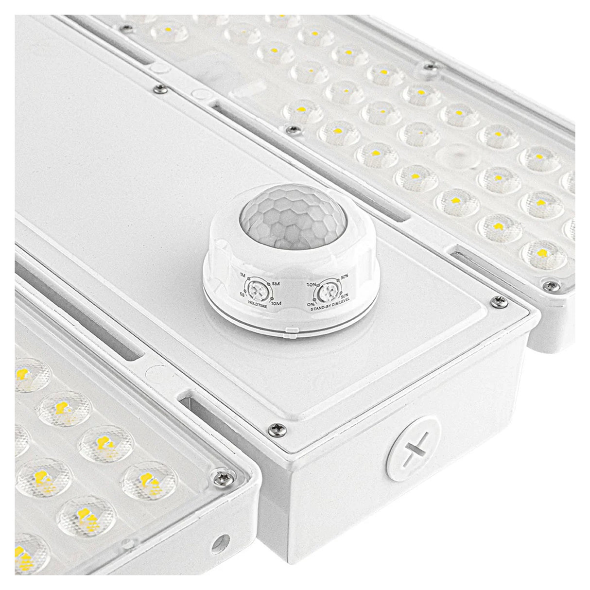 White linear high bay light with selectable LED panels and a motion sensor for industrial spaces