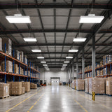 1.2FT LED linear high bay 130W illuminating wide warehouse aisle with blue pallet racks and loading dock, 20150lm DLC Premium