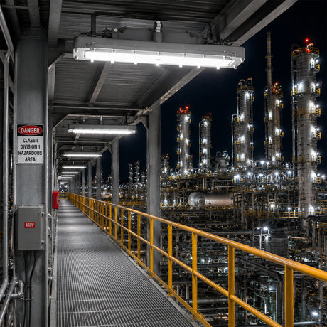 100W C1D1 explosion proof linear light illuminating a refinery catwalk with 5000K daylight.