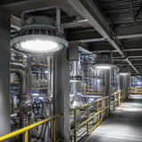 Row of 150W C1D2 LED high bay lights delivering 20,250 lumens of 5000K illumination along an industrial walkway.