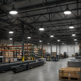 150W 23,100lm 5000K 277-480V UFO LED high bay lights illuminate an industrial warehouse with storage racks.