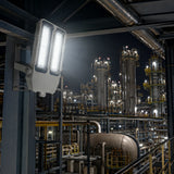 150W 21,000lm explosion proof flood light illuminating refinery equipment with 5000K light at night.