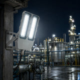 200W explosion proof flood light mounted on refinery piping for safe nighttime hazardous area illumination.