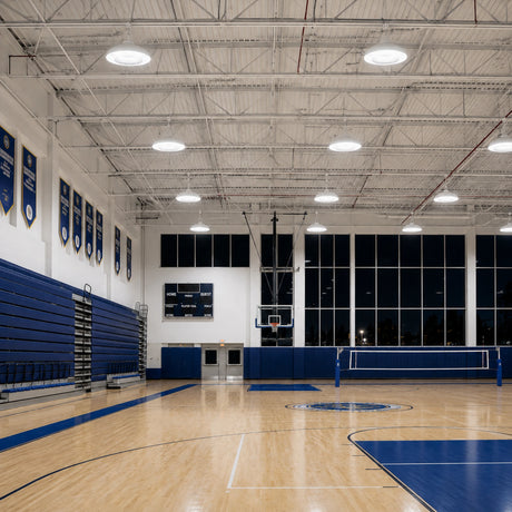 200W 29,200lm 5000K white UFO LED high bay lights illuminate an indoor gymnasium at night.