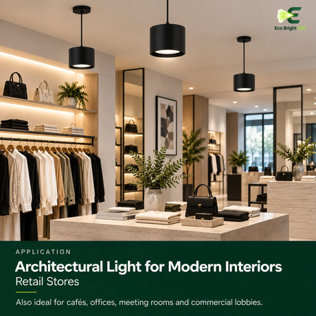 Black cylinder LED downlights illuminating a modern retail store with clothing racks and display tables