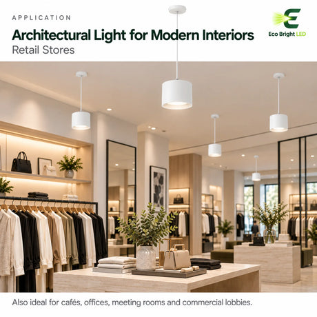 White 7-inch 12W LED cylinder downlights suspended over clothing racks in a modern retail store interior