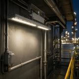 80W 12,000lm explosion proof linear light illuminating a refinery catwalk with 4000K neutral white light.