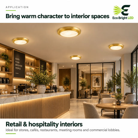 Gold 9-inch alabaster LED flush mount ceiling lights illuminating a warm retail cafe interior