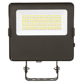Black LED flood light with integrated panel and trunnion mount for outdoor security lighting