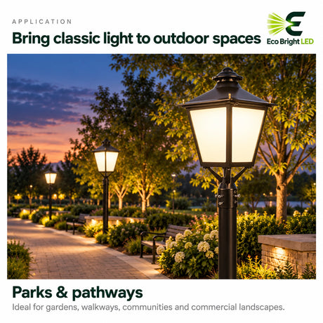 Black decorative LED post top light with classic lantern styling along a landscaped park pathway at dusk