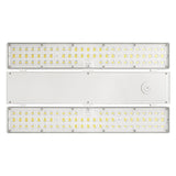 Linear LED high bay light with selectable wattage and CCT, shown with clear lens panels and white housing