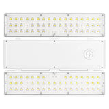 Selectable wattage linear high bay LED light with clear lens and dual side light panels