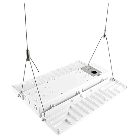 White linear high bay light fixture with hanging cables and finned heat sink for industrial lighting