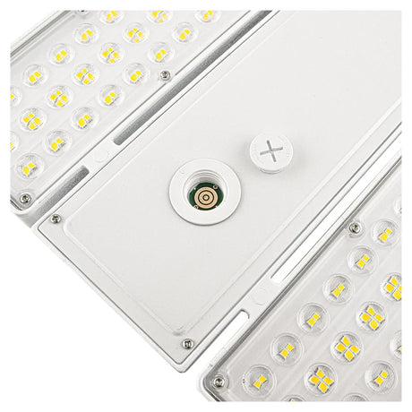 Close-up of a white linear high bay LED fixture with selectable wattage and clear lens panels