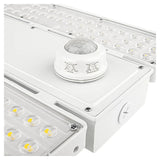 Close-up of a white linear high bay light with motion sensor and adjustable controls